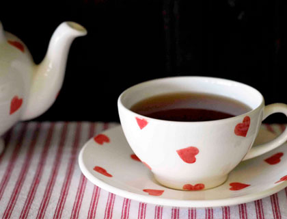 Red Heart teacup, saucer and teapot by The Little White Box