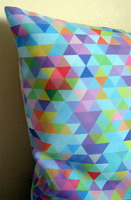 Multi-coloured Triangles Cushion Cover by Mark Catley
