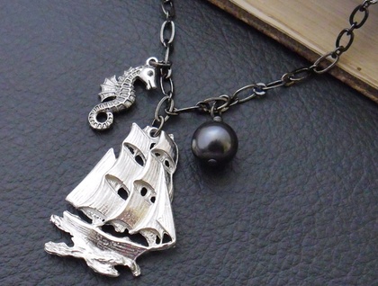 Nigh Uncatchable: a pirate-themed necklace featuring a pewter ship, antiqued-silver seahorse and black Swarovski pearl