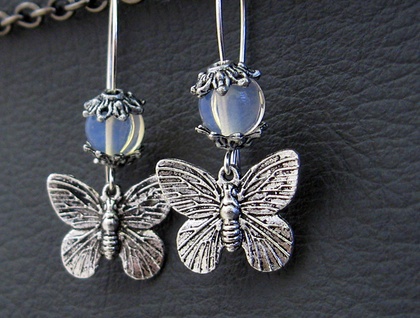 Moths In Moonlight earrings: silver moth charms with moonstone beads on silver ear-wires