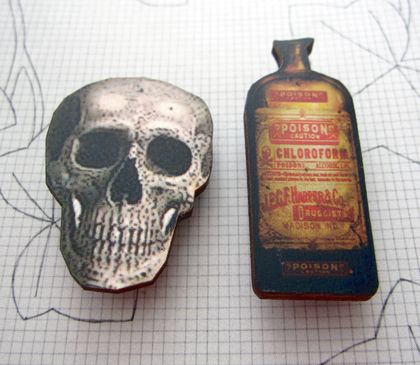 twin-set brooches - skull and poison