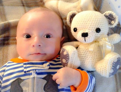 Eileen's friend's baby Alek with teddy, Edmond.