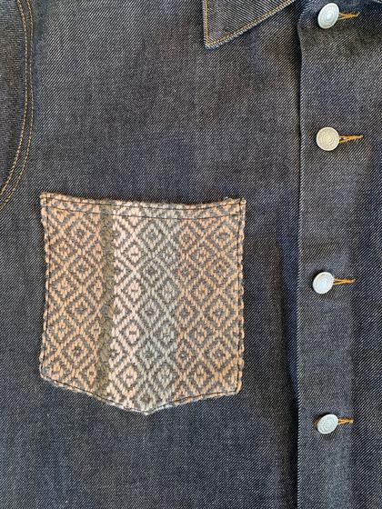 Denim jacket with handwoven detail