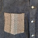 Denim jacket with handwoven detail