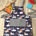 Children’s apron - cloudy with a chance of rainbows 