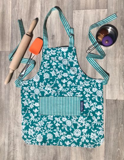 Children’s apron - flowers on teal