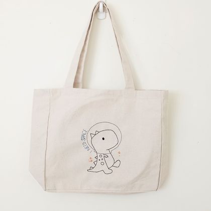 space dino hand-embroidered tote bag