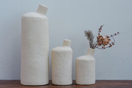 Bottle / vase with subtle raised patterns
