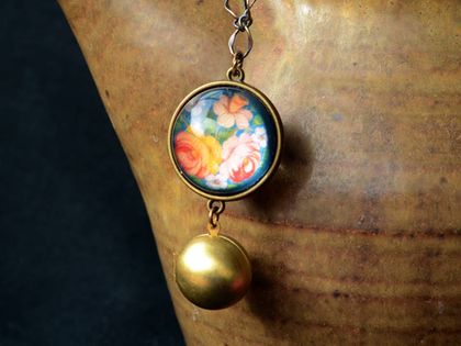 folk floral double sided globe necklace with globe locket