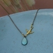 dainty teardrop pendant with swallow bird 