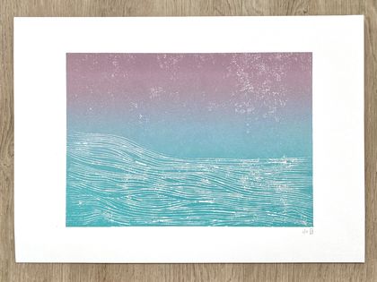 Blue waves, pink sky. Woodcut print