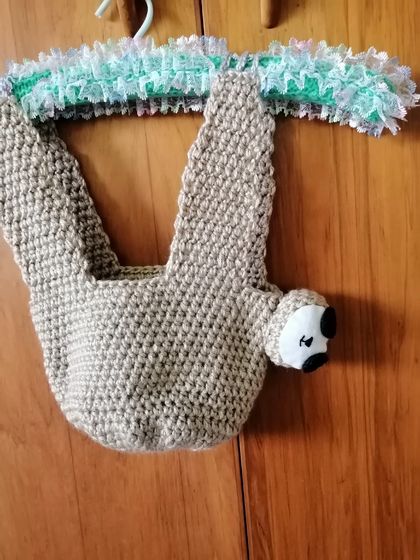 Crocheted sloth plant hanger