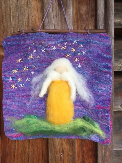 A needle-felted lady under a hand-sewn starry sky.Waldorf inspired