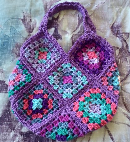 Crocheted handbag - Purple, pinks, green.