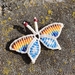 Rainbow Butterfly Charm - handwoven micro macrame