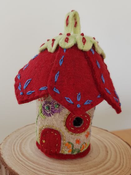 Tooth Fairy house with a dark red roof