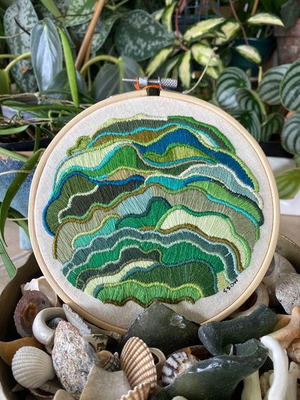 Embroidered green waves - abstract