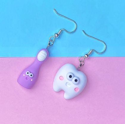 Tooth and toothbrush earrings