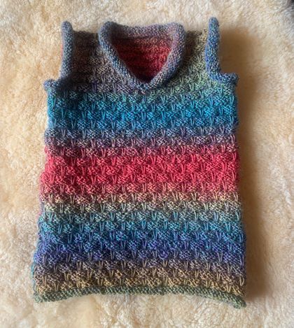 Hand knitted baby vest