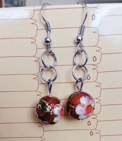 Earrings of 12mm dark red Cloisonne with beautiful green, red, pink, white and gold coloured floral highlights. 