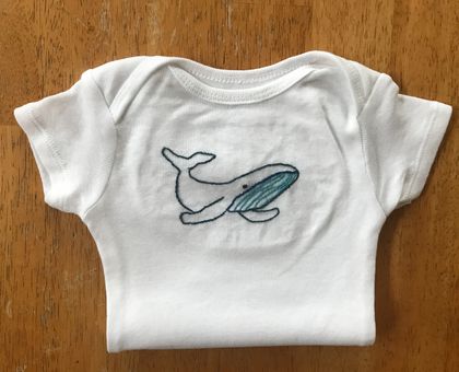 Embroidered whale baby onesie