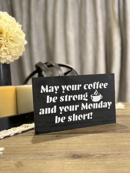 "May your coffee be strong" sign