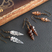 Alicorn earrings: handmade glass unicorn horns on antiqued-brass coloured hooks