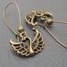 Swans In Bronze earrings: antiqued-bronze coloured swan charms on long ear-wires
