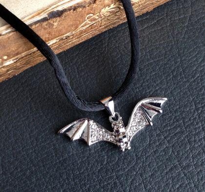 Chiroptera necklace: rhinestone-studded bat pendant on black satin cord