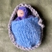 Tiny Waldorf baby in carry cot 