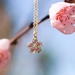 Solid gold and pink sapphire cherry blossom pendant