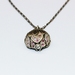 Peony bud locket pendant with pink sapphires