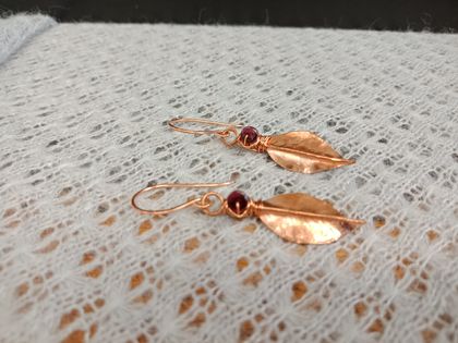 Fold formed copper leaf earrings with garnet bead
