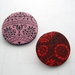 Twin set brooches - pink and red.