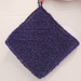 Knitted exfoliating wash cloth