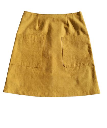 A-line skirt made in a mustard fabric.