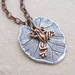 Lily Pad necklace: a small copper frog charm on a silver lily-pad pendant