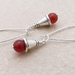 Carneole earrings: silver-capped, deep orange carnelian beads hung from silver plated ear-wires 