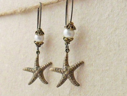 Starfish Treasure earrings in brass: lifelike, antiqued-brass starfish charms with white faux pearls