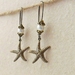 Starfish Treasure earrings in brass: lifelike, antiqued-brass starfish charms with white faux pearls
