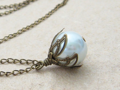 White Bud necklace: dainty, glass pearl pendant with leafy bronze-coloured caps