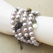The Secret Garden bracelet: memory wire wrap bracelet in with taupe faux pearls and vintage-look charms