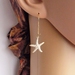 Golden Starfish earrings: lifelike, gold and white starfish charms on long ear-wires