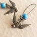 Swooping Swallow earrings: bird charms with sky blue beads on long ear-wires
