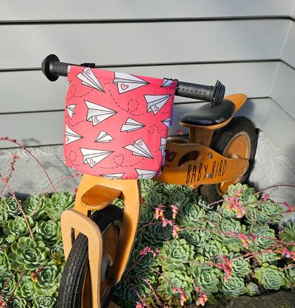 Paper Planes on Pinky Red Bike Nest