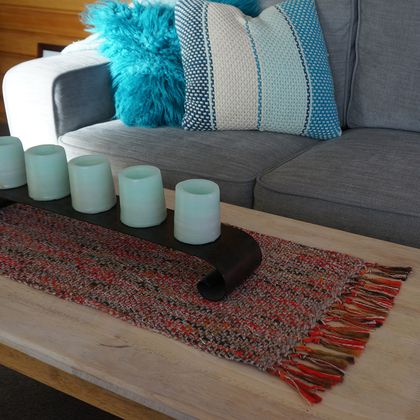 large Handwoven, textured table runner in natural stone color and reds.
