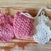 Crochet soap saver and four  flower face scrubbies