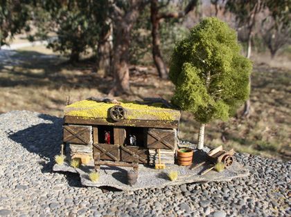 Historic replica Miniature Central Otago Stone horse stable. Made with Central rock and rusty tin. two wheel cart, two horses