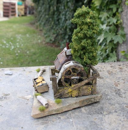 Miniature Model Stone Mining Cottage with water tank, water wheel with artificial water, gold cart with stone and artificial gold and green tree